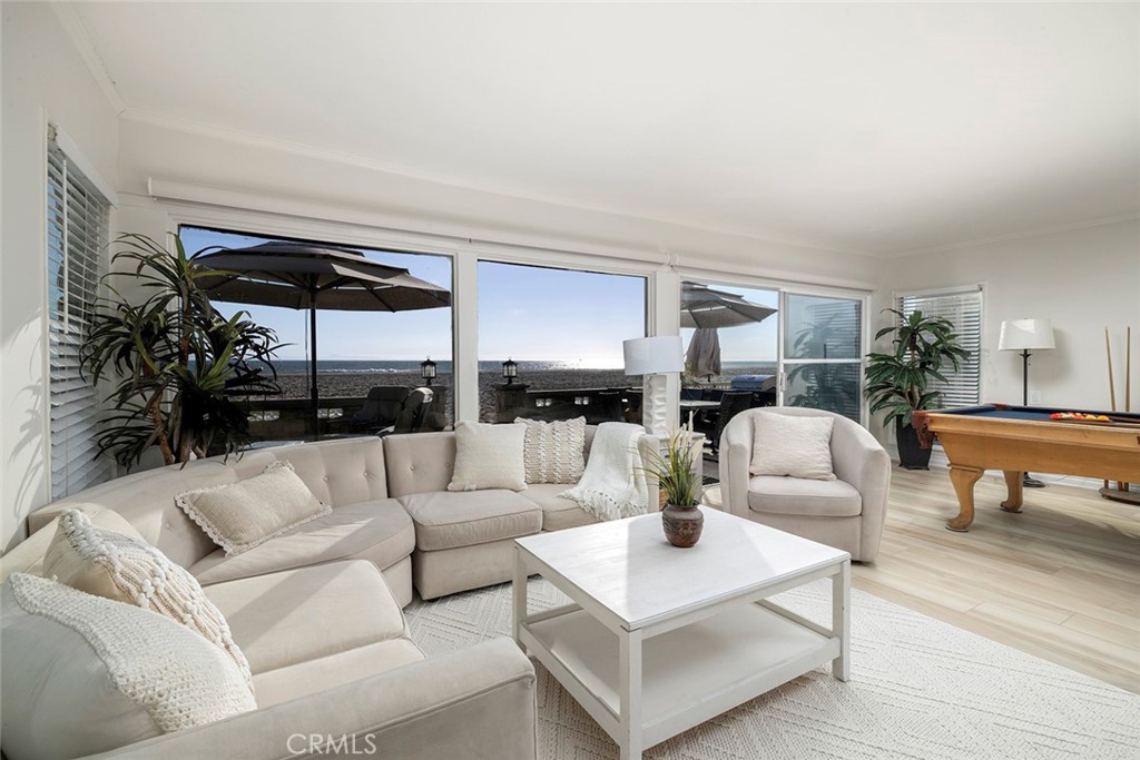 4005 Seashore Drive Newport Beach, CA 92663 - Photo 3 of 32 a living room with furniture and a large window