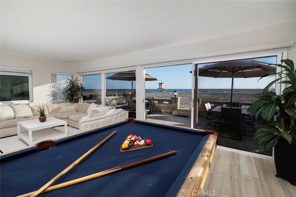 4005 Seashore Drive Newport Beach, CA 92663 - Photo 5 of 32 a living room with furniture and a table