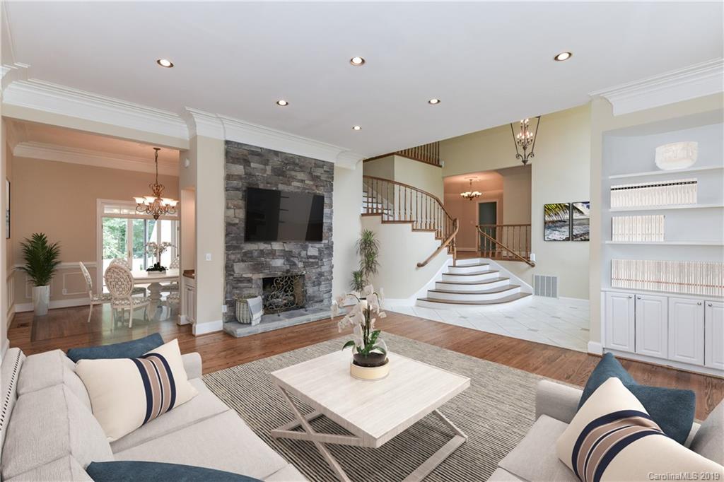 a living room with fireplace furniture and a flat screen tv