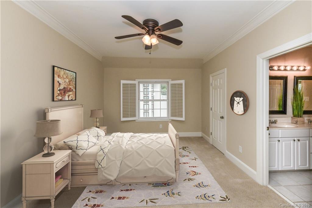 919 Colville Road Charlotte, NC 28207 - Photo 18 of 38 a bedroom with a large bed and a window