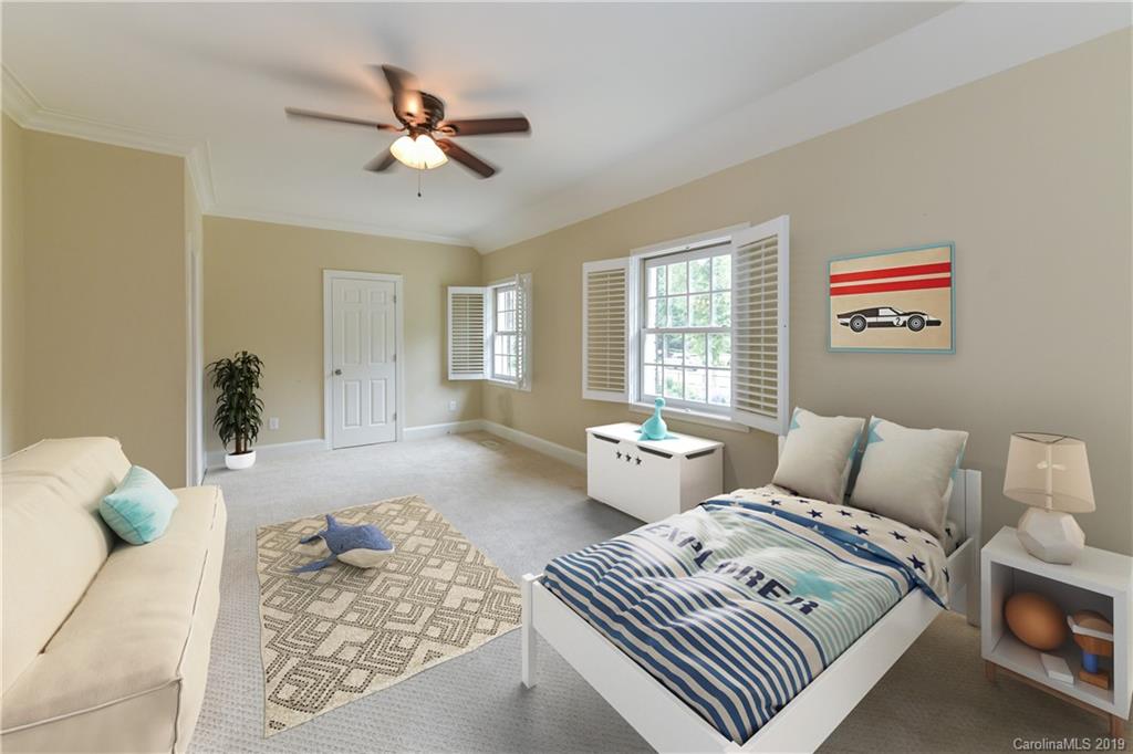 919 Colville Road Charlotte, NC 28207 - Photo 20 of 38 a bedroom with furniture and a large window