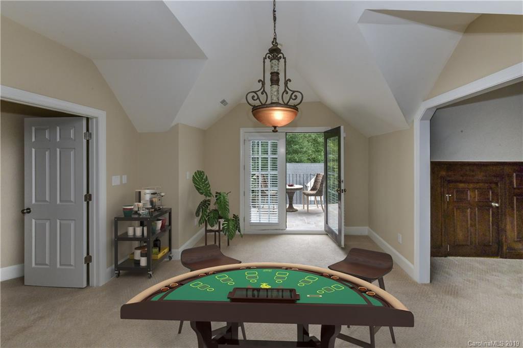 919 Colville Road Charlotte, NC 28207 - Photo 21 of 38 a room with furniture and a chandelier