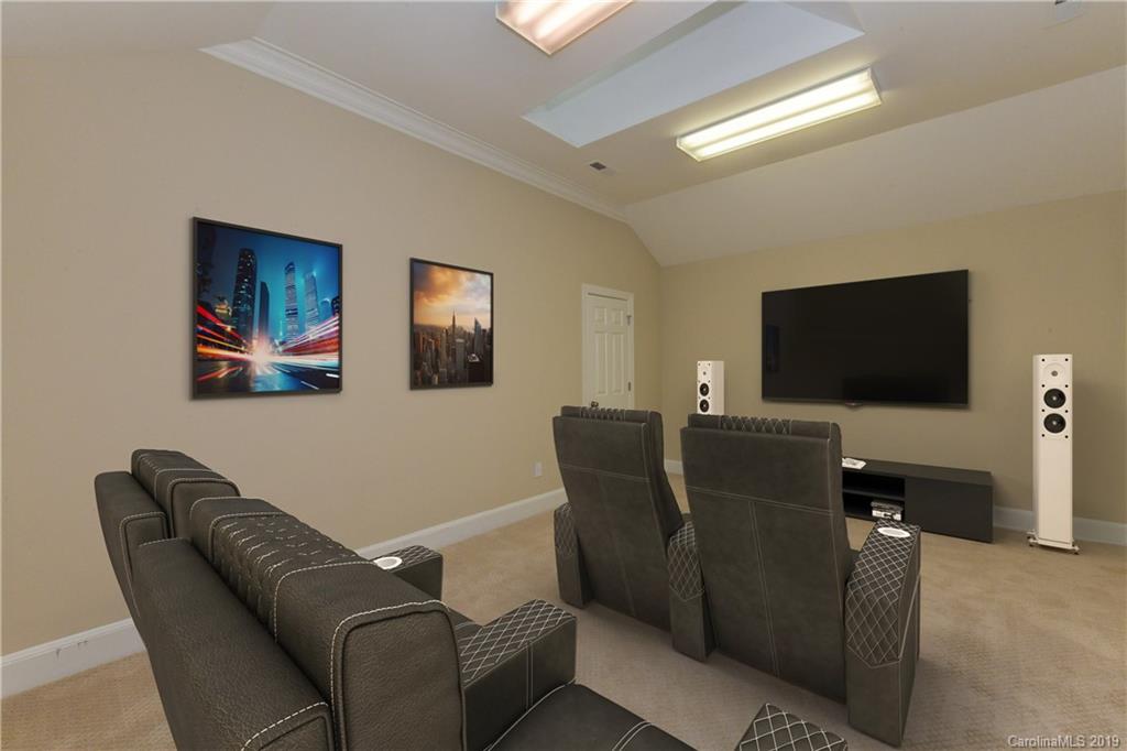 919 Colville Road Charlotte, NC 28207 - Photo 24 of 38 a living room with furniture and a flat screen tv