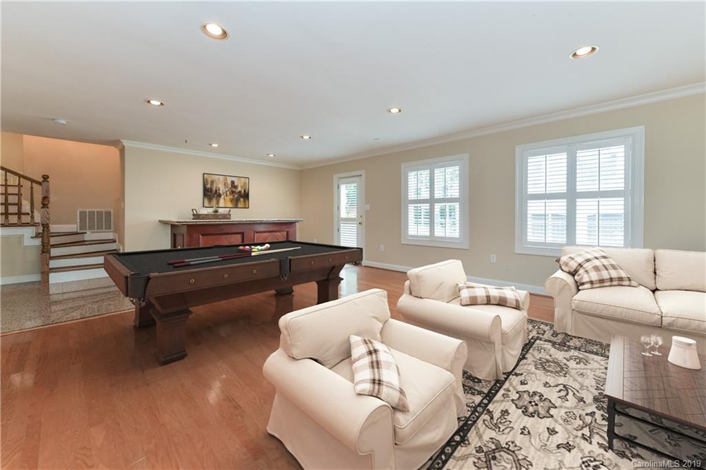919 Colville Road Charlotte, NC 28207 - Photo 26 of 38 a living room with furniture and a piano