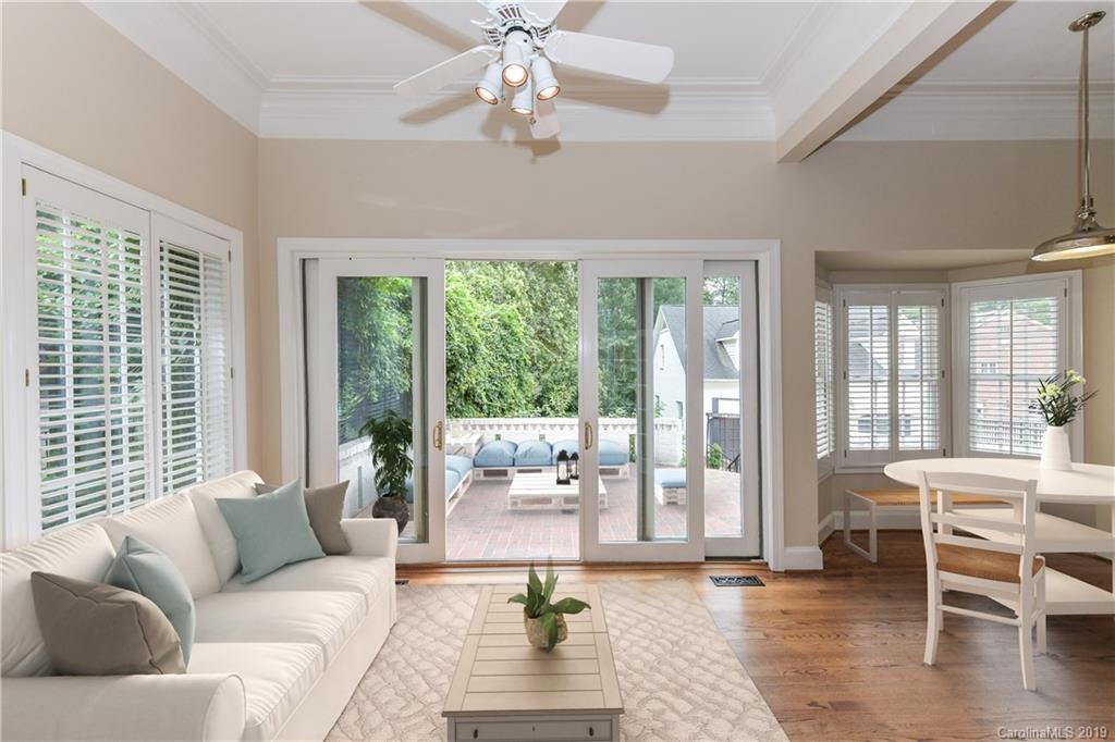 919 Colville Road Charlotte, NC 28207 - Photo 7 of 38 a living room with furniture and a large window with balcony view