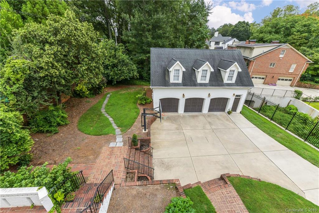 919 Colville Road Charlotte, NC 28207 - Photo 10 of 38 an aerial view of a house with a yard and a large tree