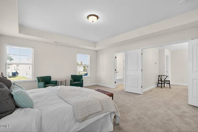 a bedroom with a bed and a couch