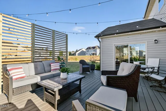 a outdoor living space with furniture and a potted plant