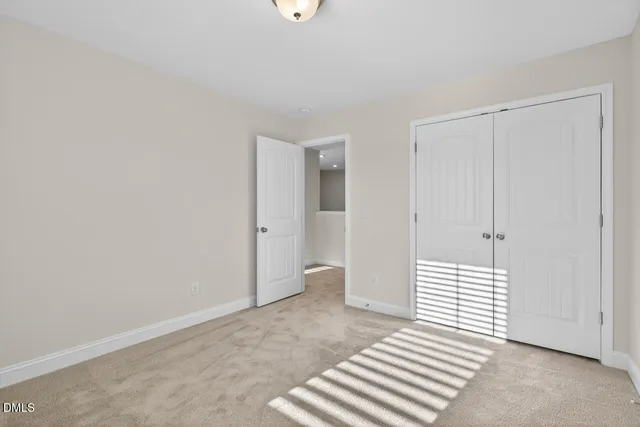 a view of a livingroom with wooden floor and cabinet