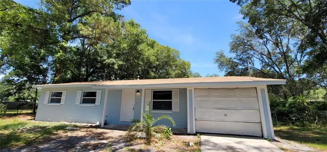 a view of a house with a garage