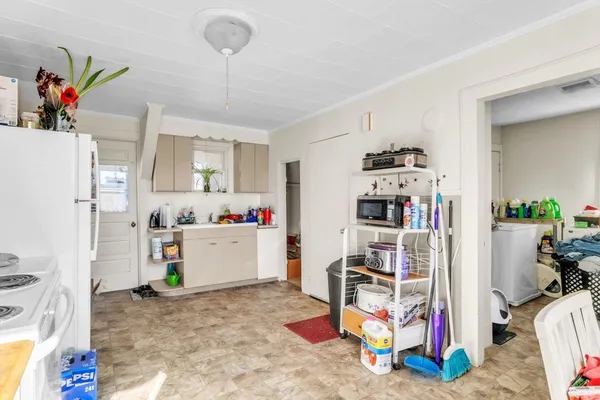 a white refrigerator freezer sitting inside of a kitchen