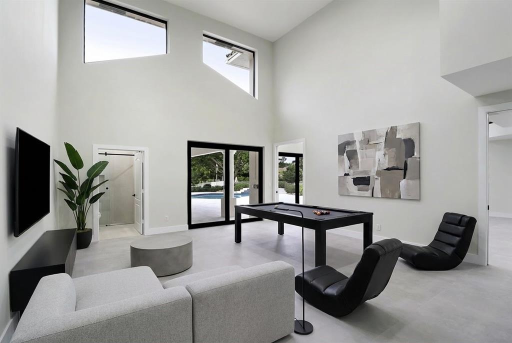 10303 Southwest 26th Street Davie, FL 33324 - Photo 14 of 35 a living room with furniture and a flat screen tv