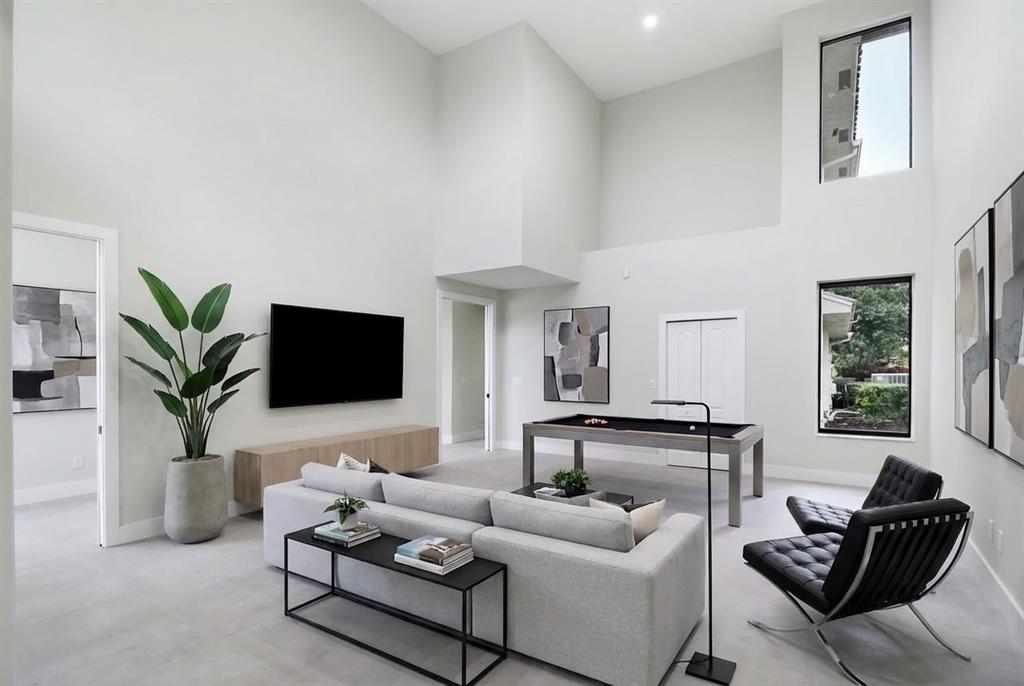 10303 Southwest 26th Street Davie, FL 33324 - Photo 15 of 35 a living room with furniture and a flat screen tv