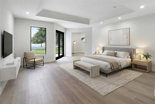 a bedroom with a large bed and a couch