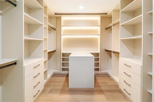 a view of walk in closet and bedroom view