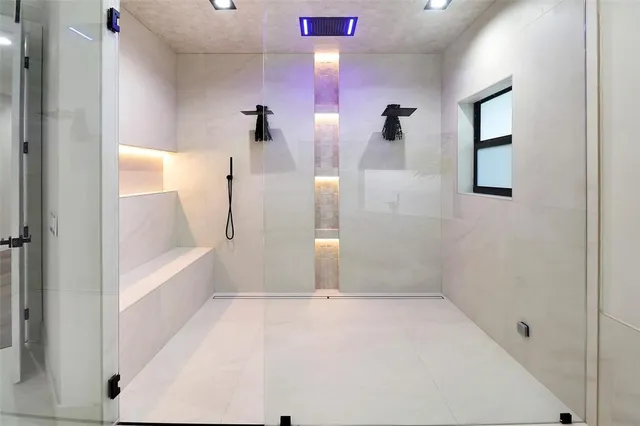 a bathroom with a bathtub and a shower