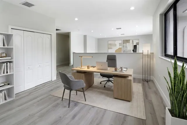 a workspace with furniture and wooden floor