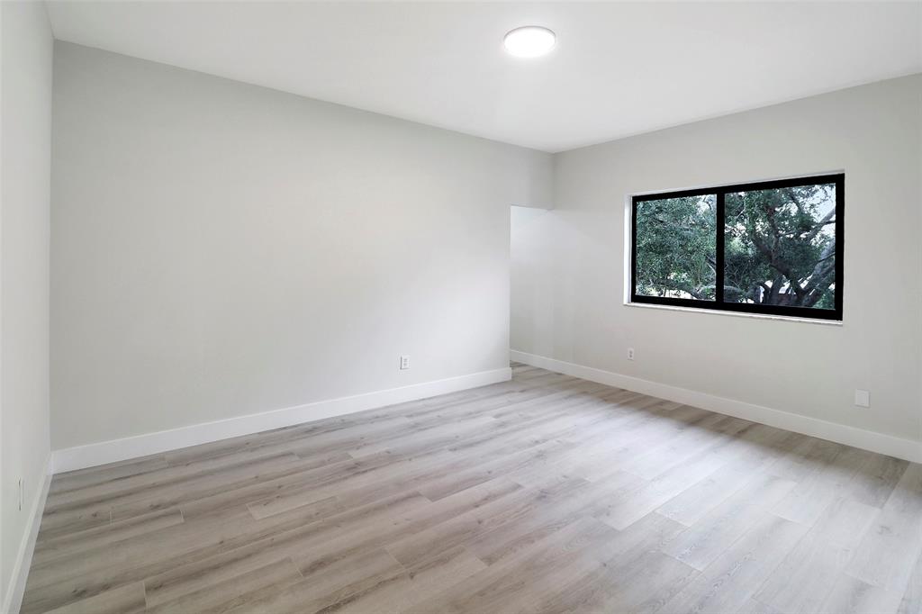 10303 Southwest 26th Street Davie, FL 33324 - Photo 30 of 35 wooden floor in an empty room with a window