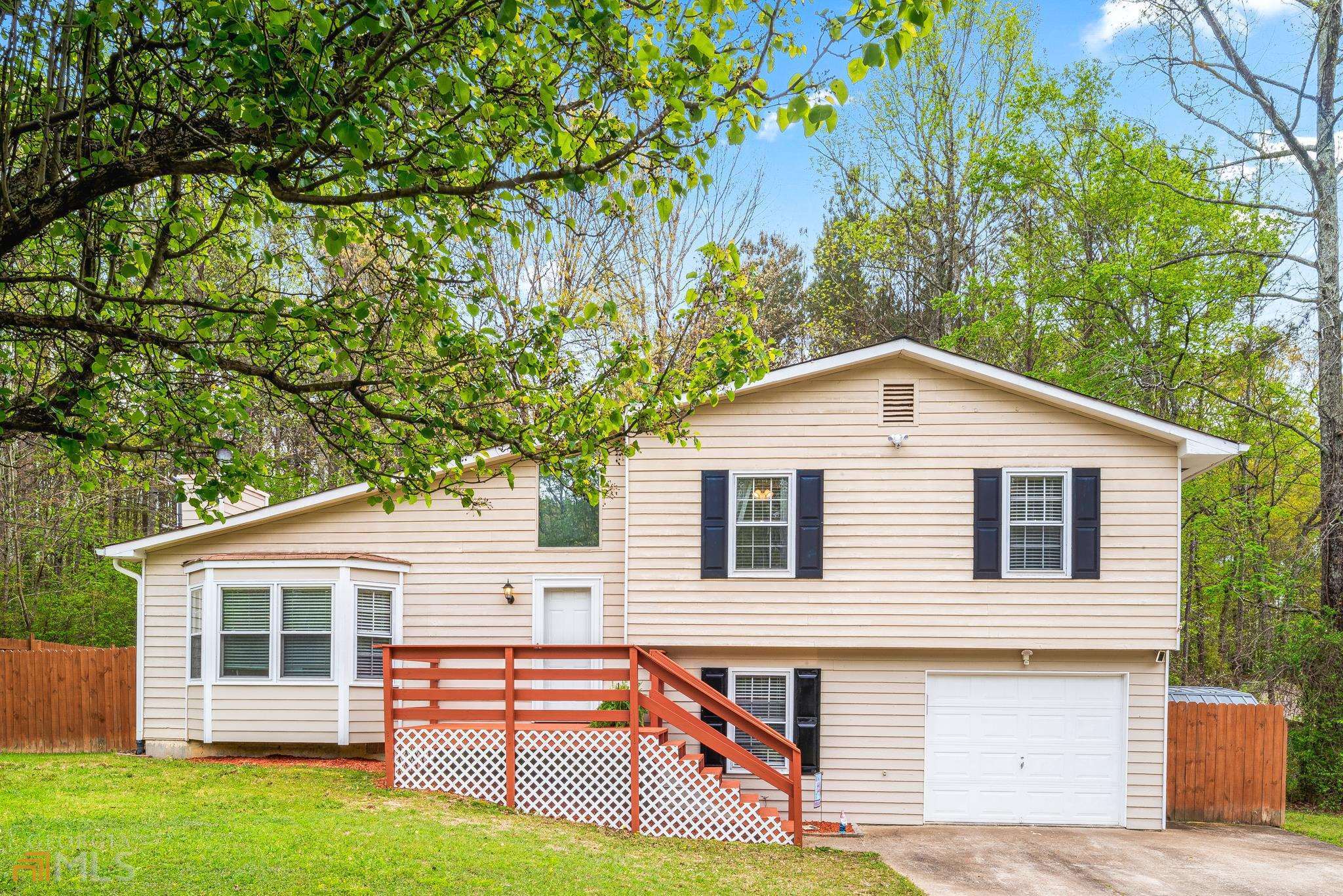 415 Freestone Drive Newnan, GA 30265 - Photo 1 of 1 a front view of a house with garage