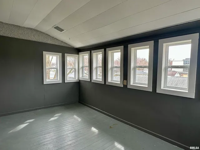 an empty room with windows