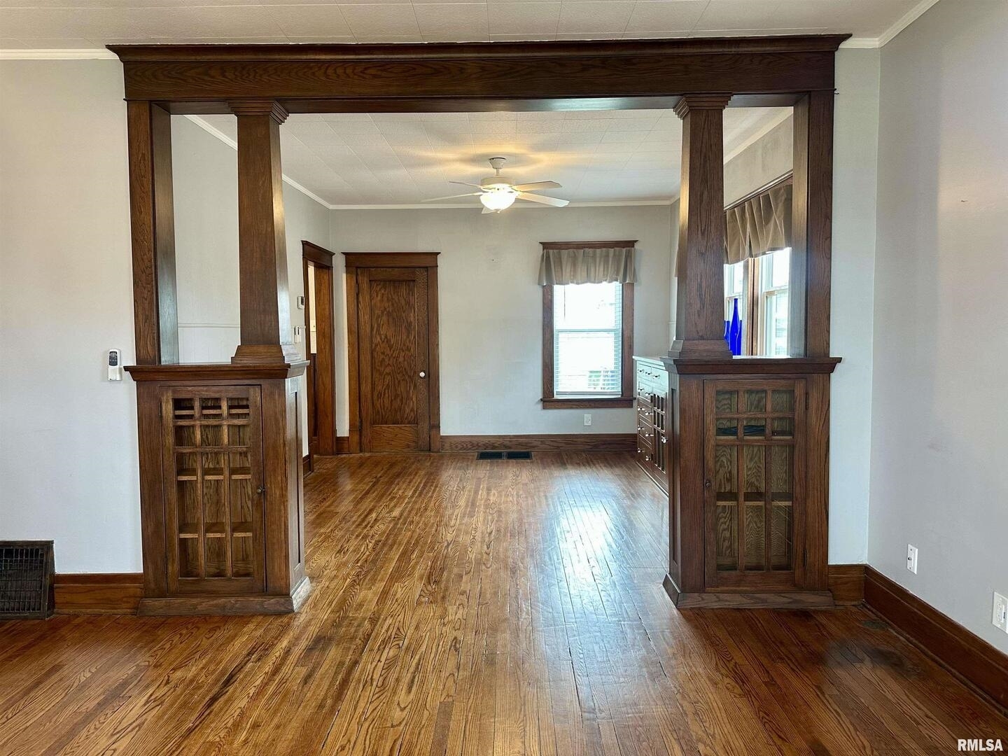 811 7th Avenue South Clinton, IA 52732 - Photo 2 of 27 wooden floor in an empty room with a window