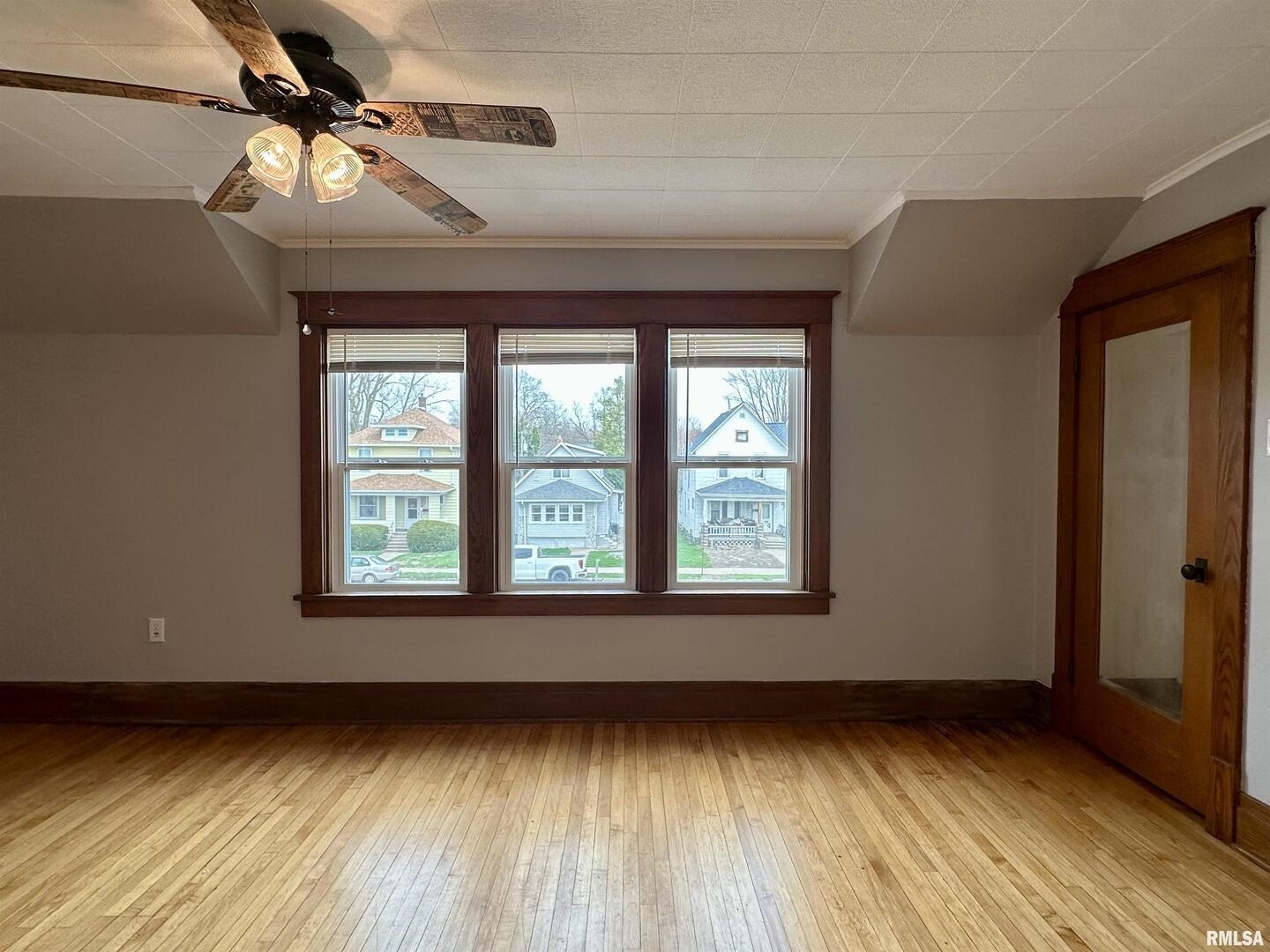 811 7th Avenue South Clinton, IA 52732 - Photo 21 of 27 a view of an empty room with a window and wooden floor