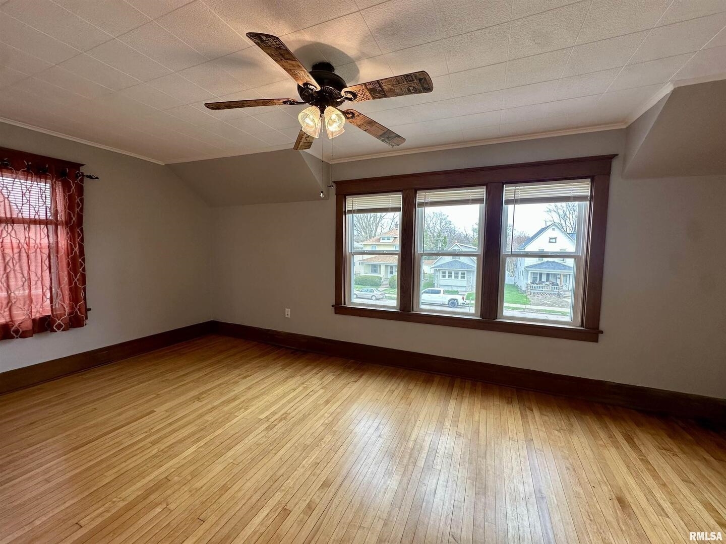 811 7th Avenue South Clinton, IA 52732 - Photo 22 of 27 a view of an empty room with wooden floor and a window