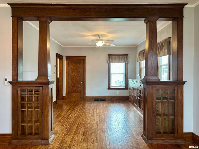 a view of livingroom with hardwood floor and a ceiling fan