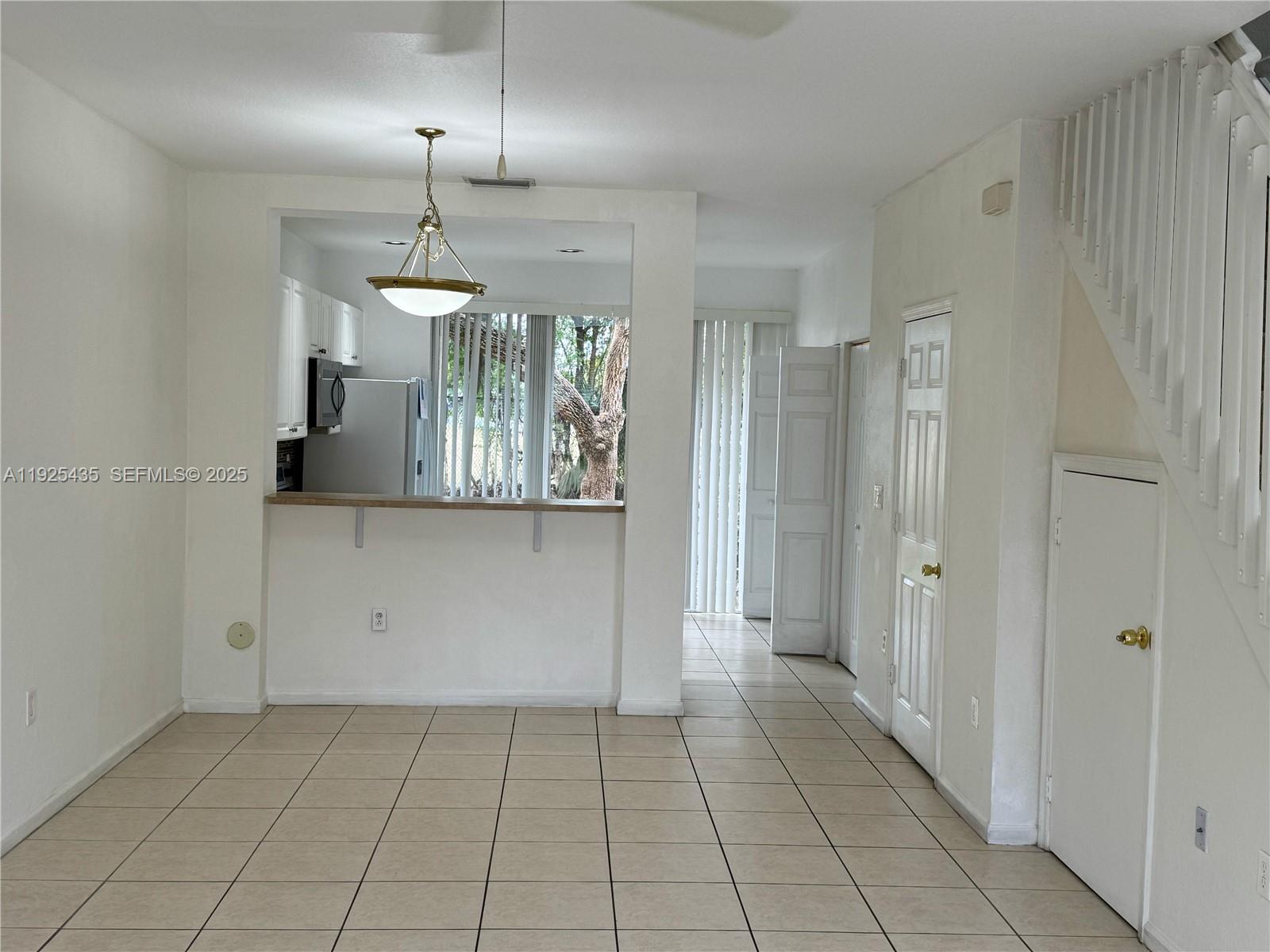 669 Northwest 42nd Avenue Plantation, FL 33317 - Photo 3 of 14 a view of a kitchen with cabinet and refrigerator