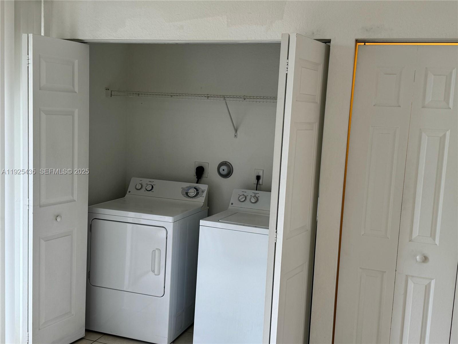 669 Northwest 42nd Avenue Plantation, FL 33317 - Photo 6 of 14 a utility room with dryer and washer