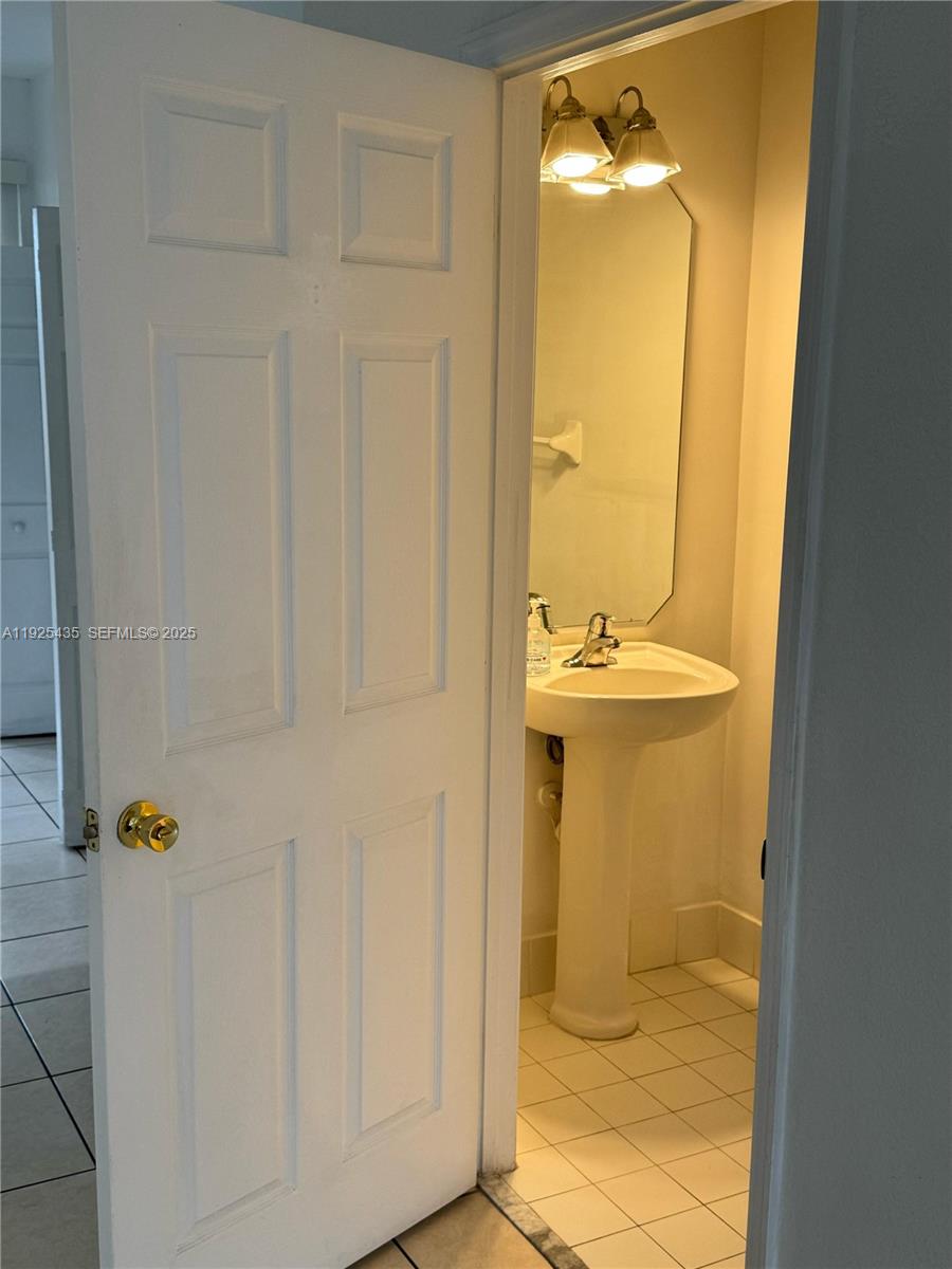 669 Northwest 42nd Avenue Plantation, FL 33317 - Photo 7 of 14 a bathroom with a sink