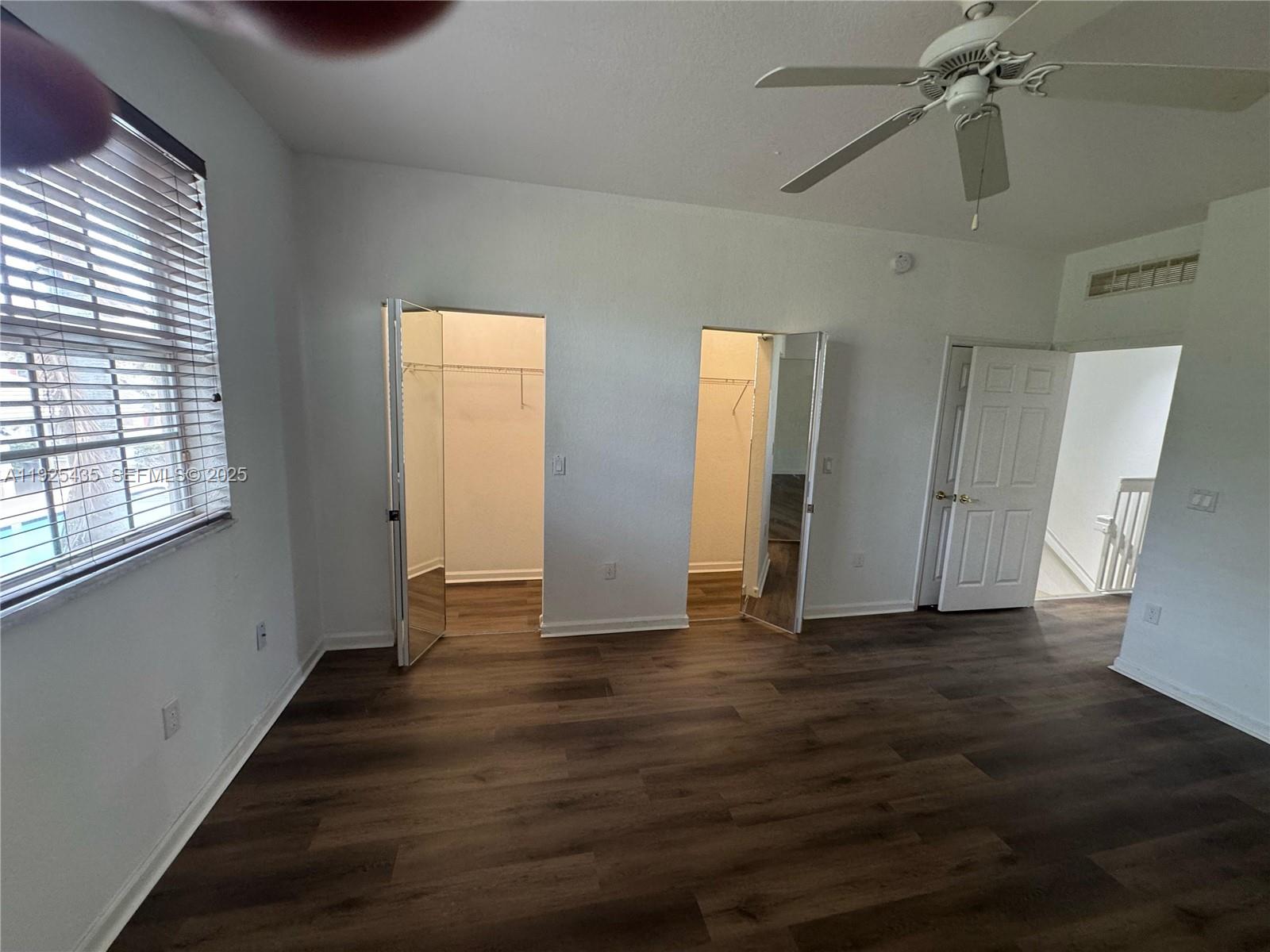 669 Northwest 42nd Avenue Plantation, FL 33317 - Photo 10 of 14 a view of an empty room with wooden floor and a window