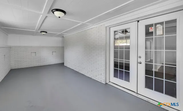 a view of a room with windows