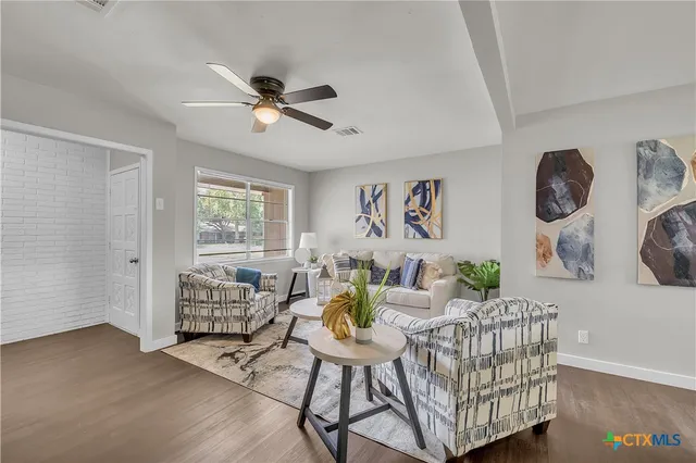 a living room with furniture and a window