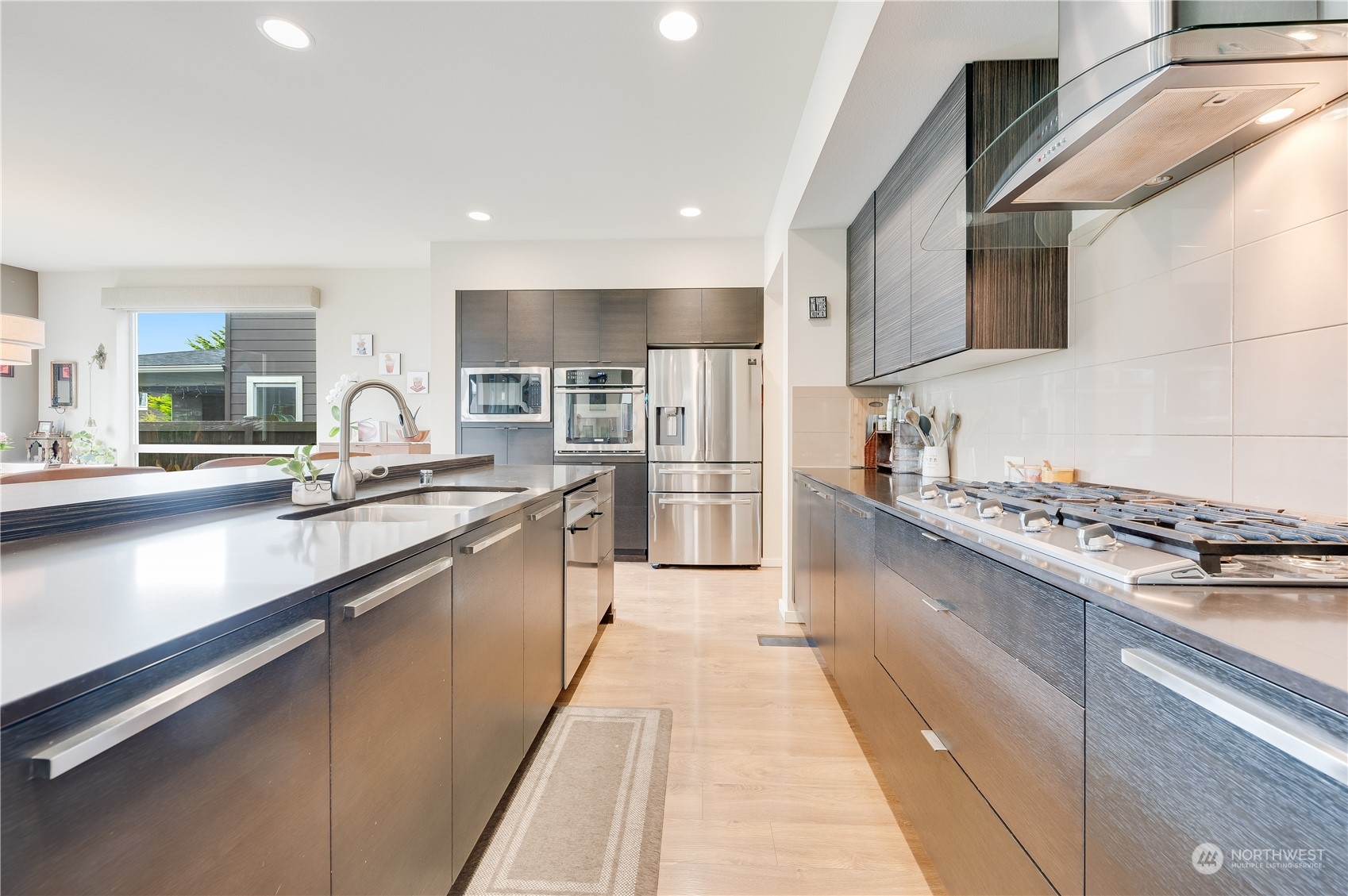 4016 171st Street Southeast Bothell, WA 98012 - Photo 11 of 39 a large kitchen with stainless steel appliances lots of counter space and a sink