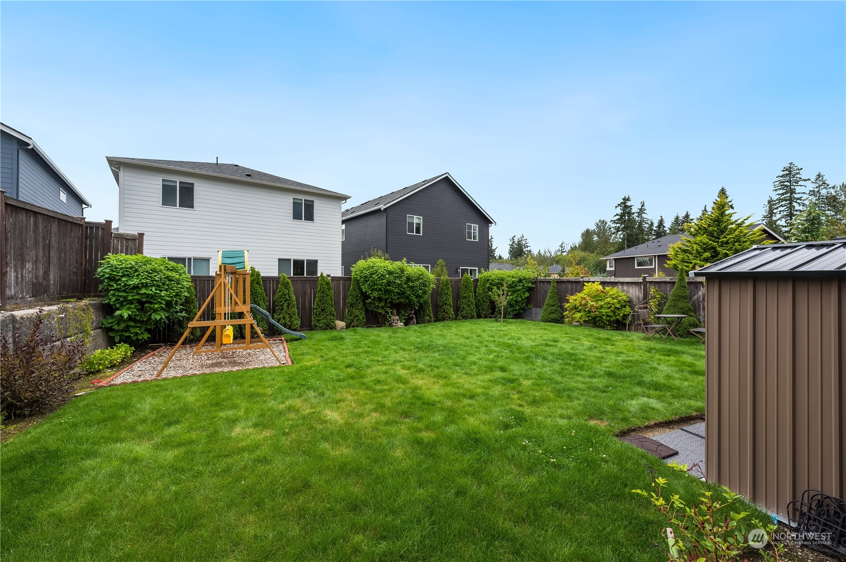 4016 171st Street Southeast Bothell, WA 98012 - Photo 20 of 39 a view of a house with backyard and a garden