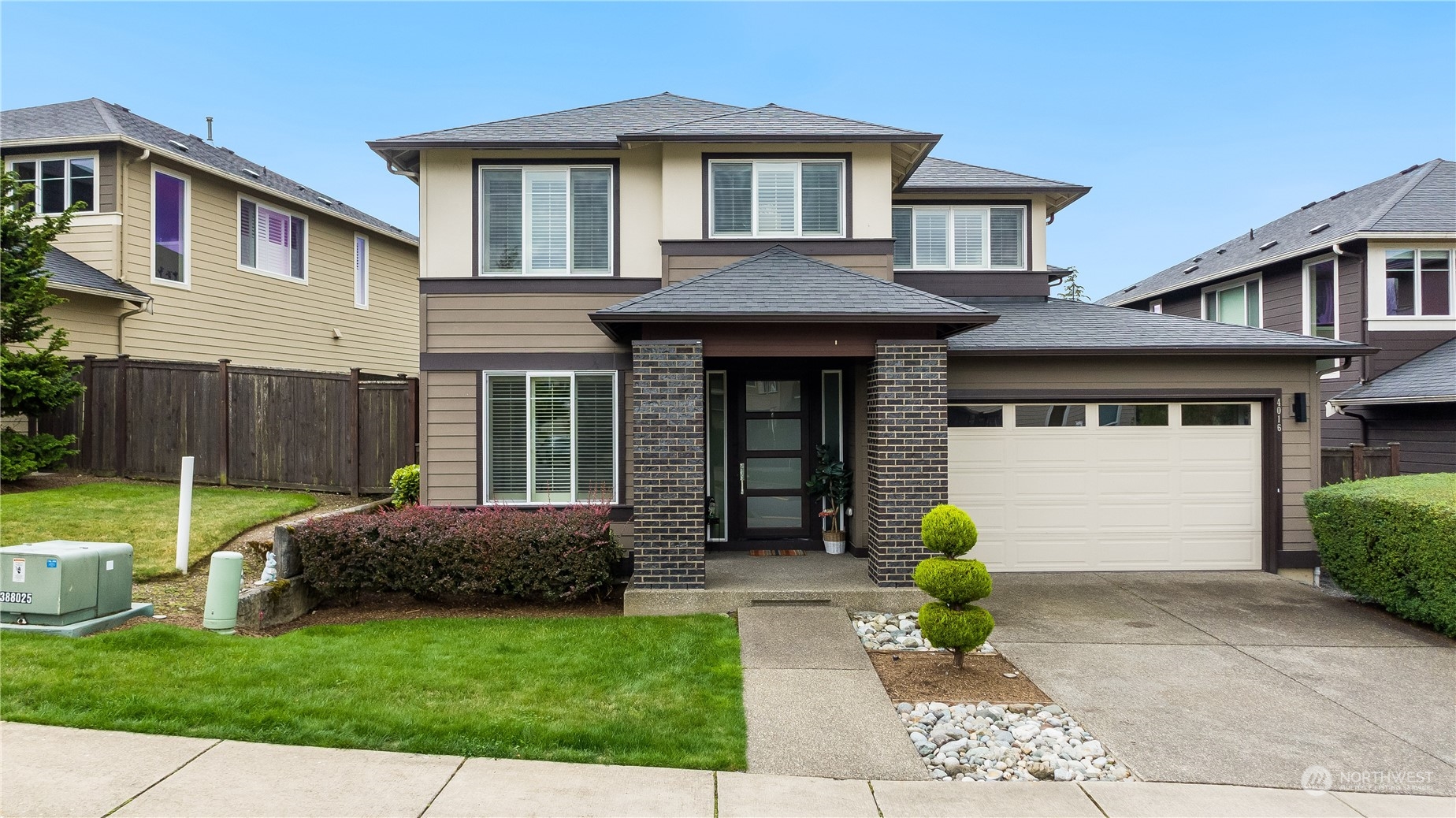 4016 171st Street Southeast Bothell, WA 98012 - Photo 2 of 39 a front view of a house with garden