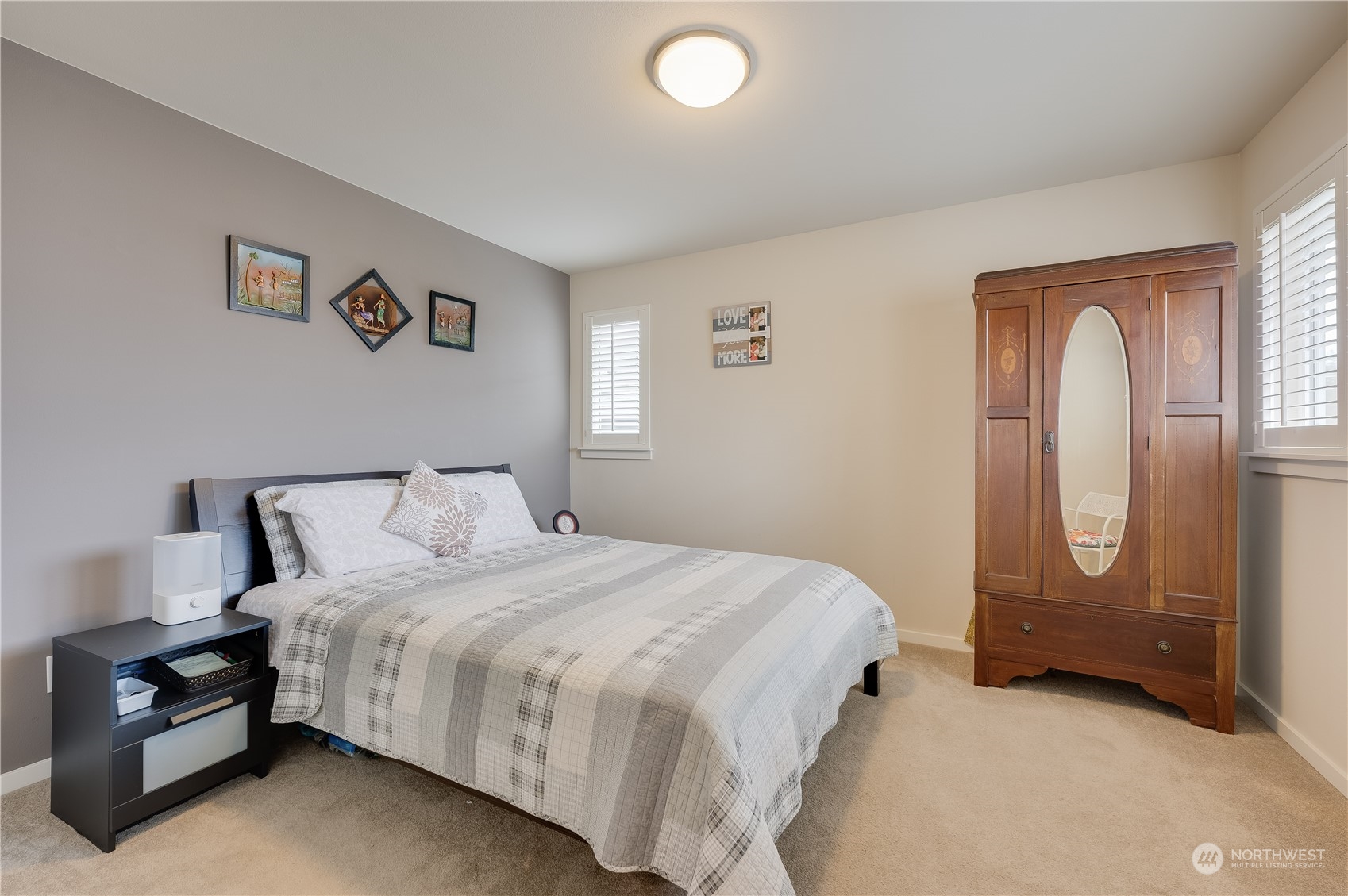 4016 171st Street Southeast Bothell, WA 98012 - Photo 27 of 39 a bedroom with a bed and a painting on the wall