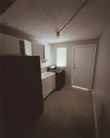 a white toilet sitting next to a bath tub