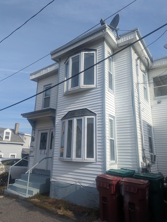 a front view of a house with a garage