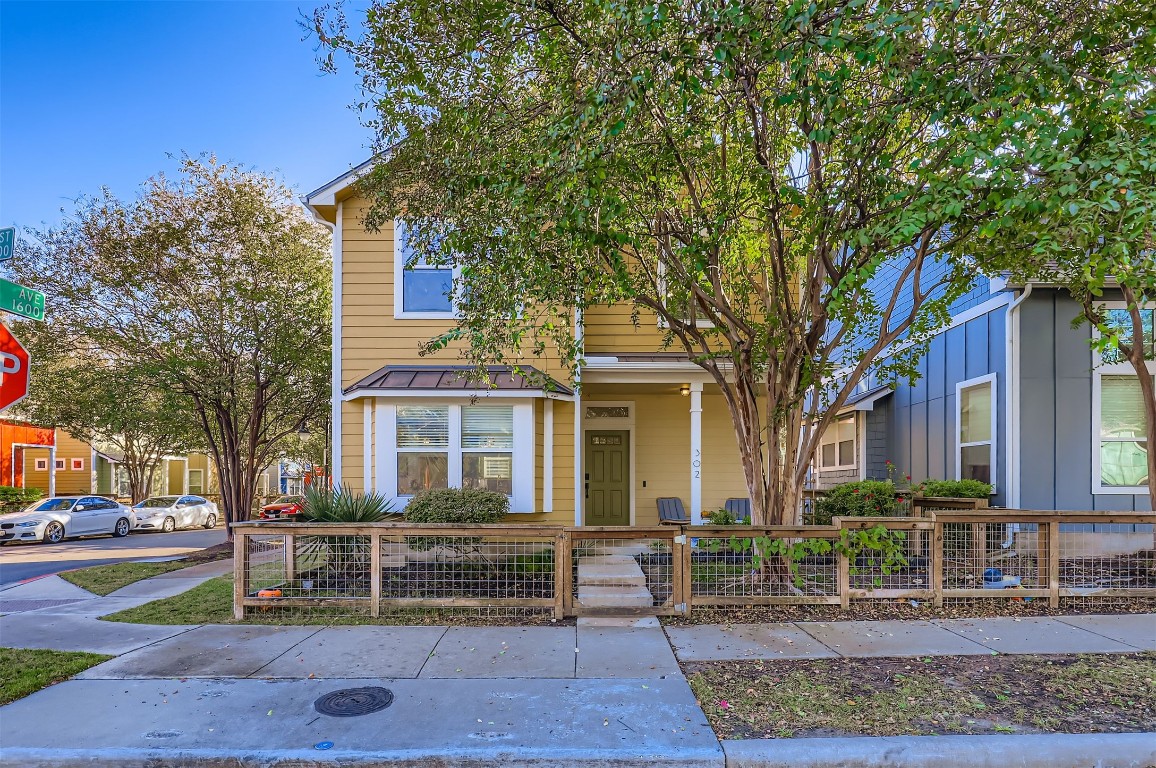 1601 Miriam Avenue, Unit 302 Austin, TX 78702 - Photo 1 of 29 View of front of property with covered porch and a fenced front yard
