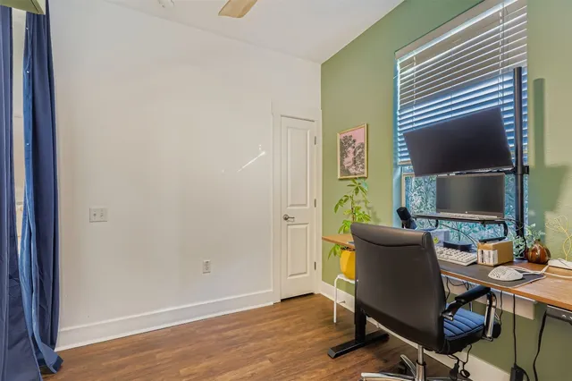 a workspace with furniture and wooden floor