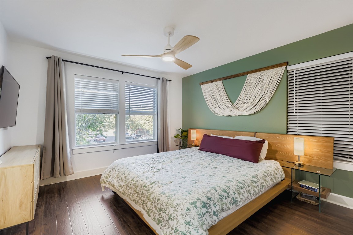 1601 Miriam Avenue, Unit 302 Austin, TX 78702 - Photo 14 of 29 Bedroom with dark wood-type flooring and a ceiling fan