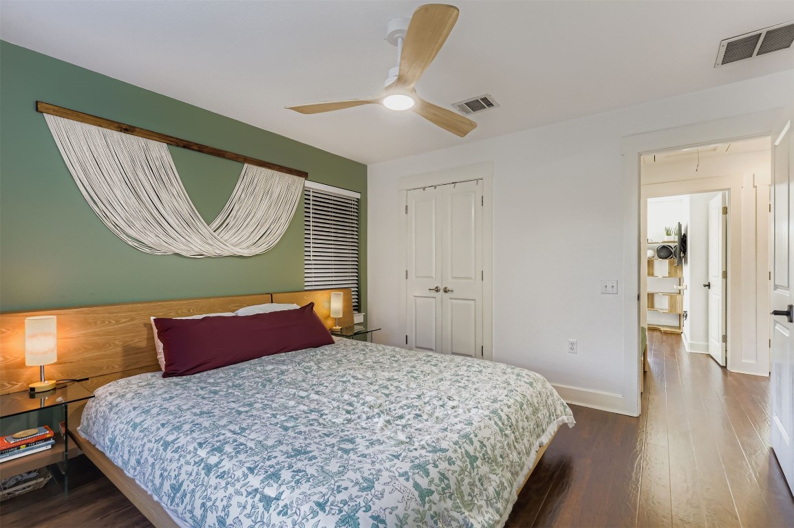 1601 Miriam Avenue, Unit 302 Austin, TX 78702 - Photo 15 of 29 Bedroom featuring dark wood-type flooring, a closet, and ceiling fan
