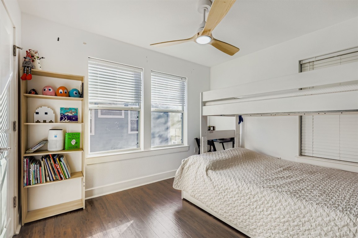 1601 Miriam Avenue, Unit 302 Austin, TX 78702 - Photo 22 of 29 Bedroom featuring dark wood-style floors and ceiling fan