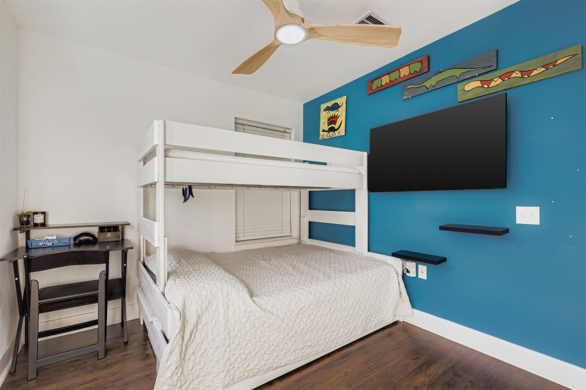 1601 Miriam Avenue, Unit 302 Austin, TX 78702 - Photo 23 of 29 Bedroom with dark wood-type flooring and ceiling fan
