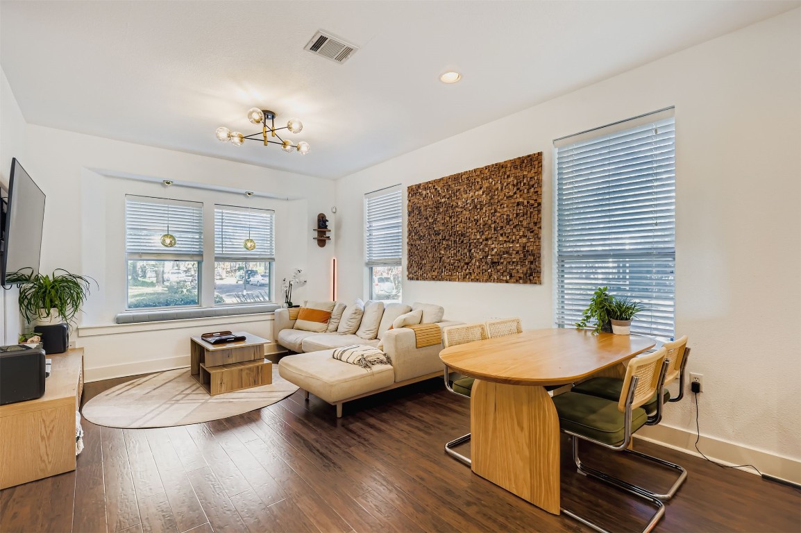 1601 Miriam Avenue, Unit 302 Austin, TX 78702 - Photo 3 of 29 Living area with wood-type flooring, a chandelier, and recessed lighting