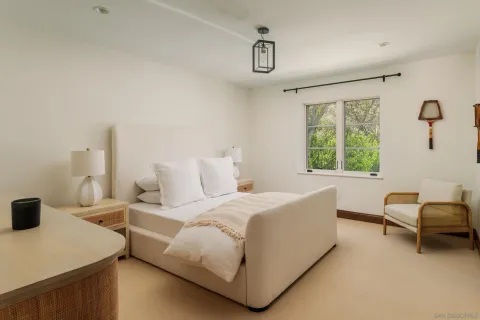 a bedroom with a bed and a couch