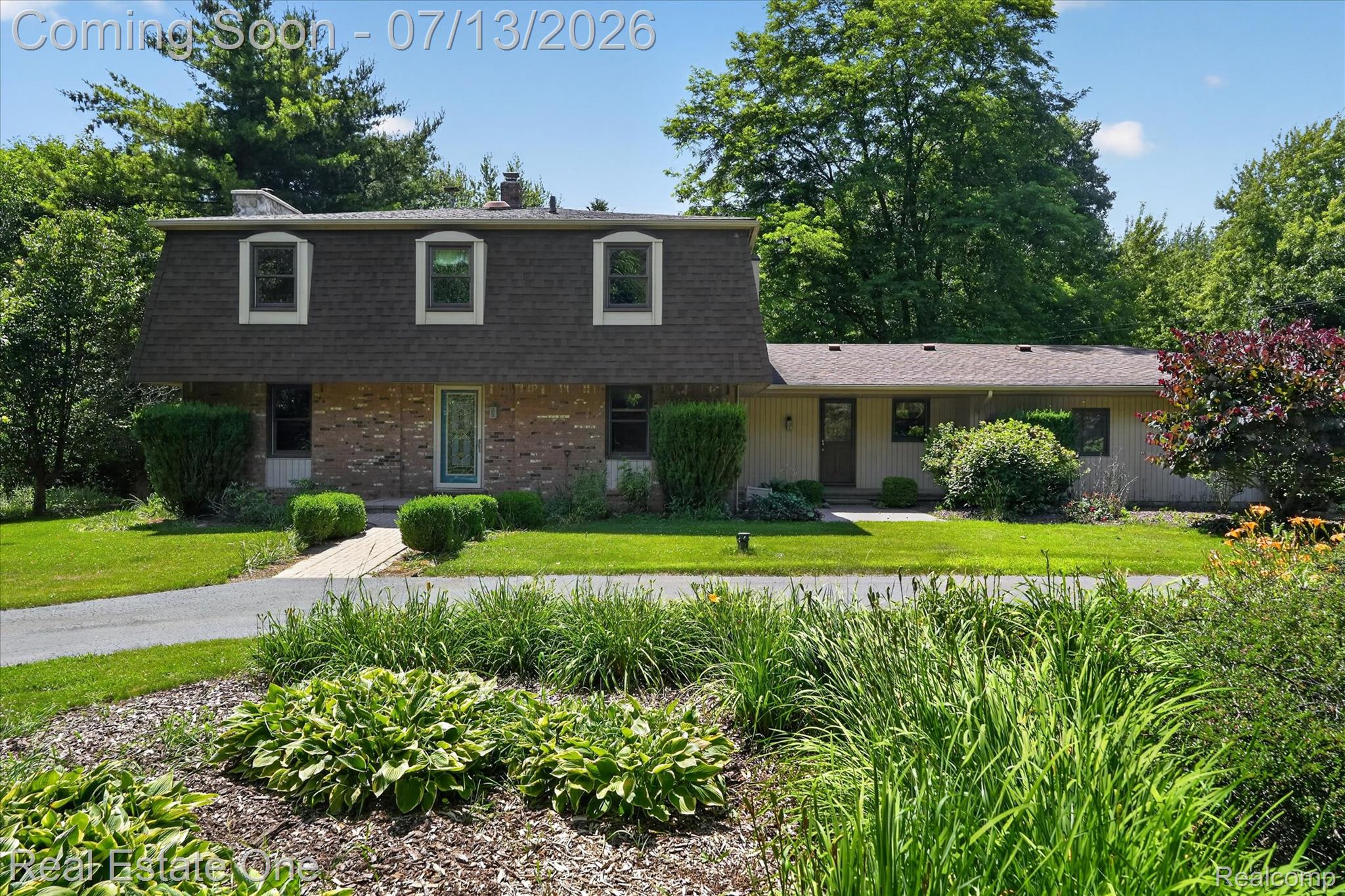 6039 Fish Lake Road Holly, MI 48442 - Photo 1 of 70 meticulously maintained Dutch Colonial with a circular driveway and many flower gardens to enjoy.
