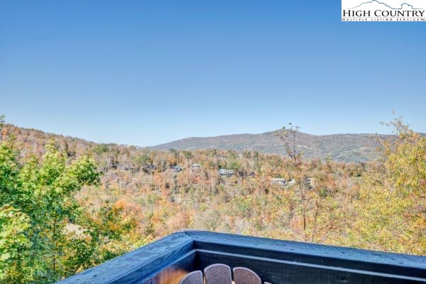 144 Skyleaf Lane, Unit 703 Sugar Mountain, NC 28604 - Photo 15 of 29 a view of a mountain from a balcony